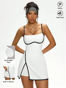 White tennis dress with black contrast trim, built-in shorts and removable cups