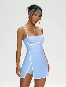 Front view of light blue tennis dress with contrast white piping and slit detail