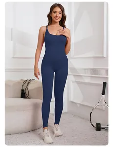 Full-body shot of a navy blue seamless yoga jumpsuit with criss-cross back straps