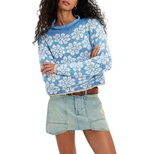 Cozy blue and white floral pattern knitted sweater featuring a loose fit and round neck