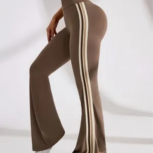 Professional high-waisted brown flared yoga pants with chic side stripes for workout