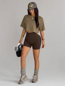 Sporty seamless high waist biker shorts and earthy brown crop top set on model