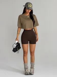 Sporty brown yoga set with crop t-shirt and high-waisted biker shorts
