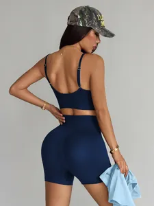 Detailed back view of a navy blue seamless yoga set with high-waisted shorts and bra