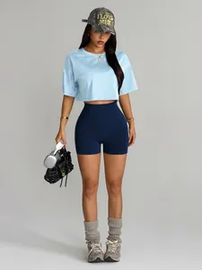 Asian model wearing blue seamless high-waist yoga shorts and cropped T-shirt outfit
