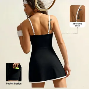 Detail view of athletic tennis dress featuring adjustable straps and functional side pocket.