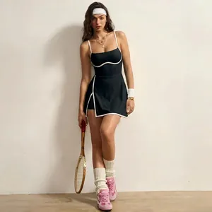 Stylish black tennis dress with white contrast trim and vintage sports accessories