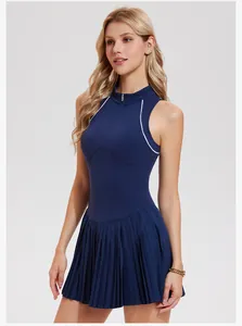 Detail view of navy blue sleeveless tennis dress with half-zip and pleated skirt