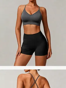 Detailed front and cross-back view of grey seamless yoga bra with black shorts.