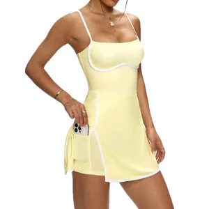 Elegant yellow athletic yoga dress featuring white piping and side phone pocket