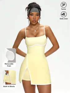 Yellow tennis dress with contrast piping, removable cups, and built-in shorts