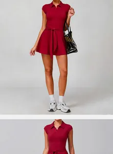 Detailed view of a wine red athletic tennis dress with polo collar and waist tie detail