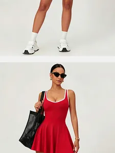 Sporty red tennis dress with white contrast trim and pleated skirt detail view