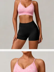 High-quality detail view of a seamless pink marble yoga bra with thin straps and V-neckline