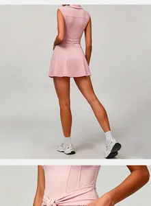 Back view and waist detail of a pink tennis dress with built-in athletic shorts.