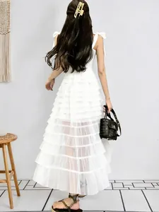 Detailed back view of an elegant white tiered mesh sleeveless sleeveless maxi dress for women