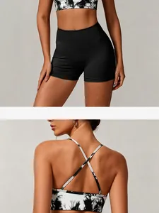 Close-up of back cross straps on tie-dye yoga bra and seamless black sports shorts