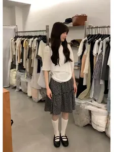 Elegant Korean style floral skirt set with white five-point sleeve top in boutique