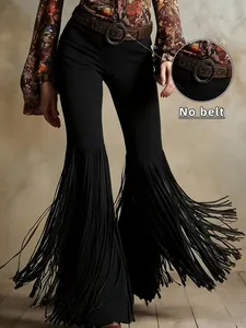 Detailed view of women's retro western black suede trousers with long fringe flares