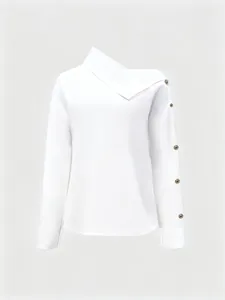 Detailed view of white high-neck top featuring asymmetric gold buttons and long sleeves.