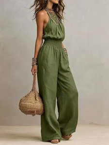 Detailed view of an olive green linen sleeveless jumpsuit with elastic waist