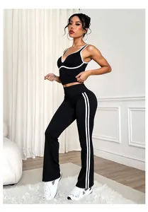 Detailed side view of a black and white contrast yoga set with flared pants and sports bra