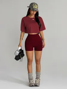 Close-up of a wine red seamless yoga set including high-waist shorts and a crop top