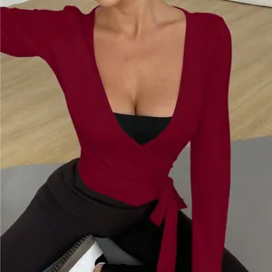 Breathable burgundy long sleeve yoga wrap top with side tie waist for active women