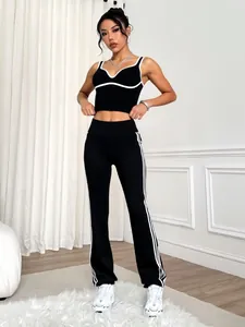 Modern black and white color-block yoga set featuring a sports bra and flared leggings.