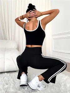 Chic black and white contrast yoga set featuring flared leggings and crop tank top