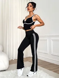 Contrast black and white yoga set with sports bra and flared leggings
