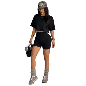 Women's seamless high-waisted biker shorts and crop top athletic yoga set in black finish
