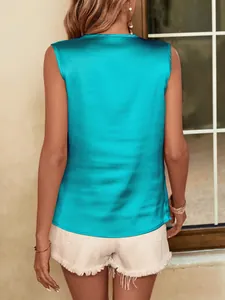 Detail back view of a vibrant turquoise sleeveless satin blouse with elegant fit