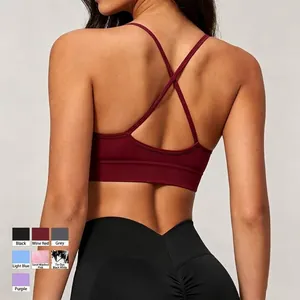 Seamless knit yoga sports bra with elegant criss-cross back straps in burgundy finish
