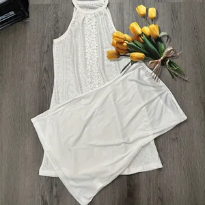 Elegant white halter lace mini dress featuring delicate hollow-out floral patterns