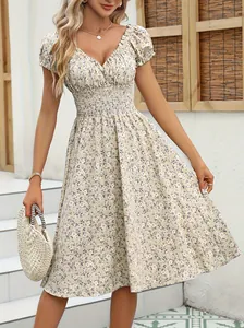 Close-up detail of vintage floral French style dress with puff sleeves and V-neckline