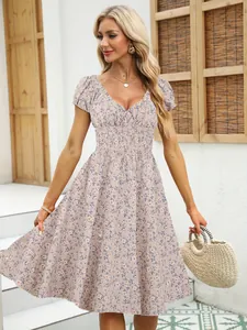 Detail view of a vintage floral puff sleeve French V-neck dress for women on a model