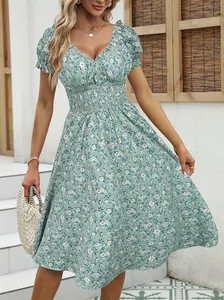 Close-up detail of a light green French vintage floral puff sleeve midi dress showing fabric