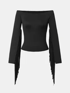 High-quality detail of black vintage western style tight top with long fringe tassels