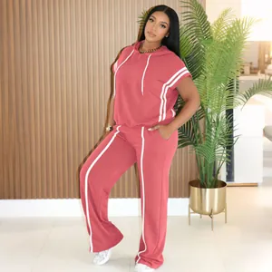 Full view of women's coral sporty two-piece hooded set with white stripe detail