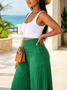 Stylish green high-waisted pleated wide-leg trousers for a summer beach vacation.