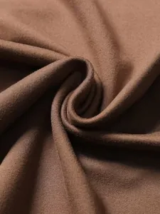 Detailed macro view of the soft brown knit fabric on a vintage tight-fitting T-shirt.