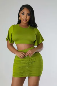 Sexy green two-piece outfit with a ruched bodycon skirt and short flutter sleeve crop top