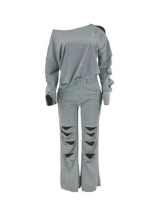 Gray ripped two-piece tracksuit featuring off-shoulder sweatshirt and distressed pants