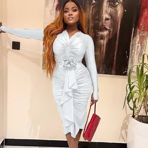 Elegant white long-sleeved ruched dress with detailed rose applique and sexy V-neckline feature