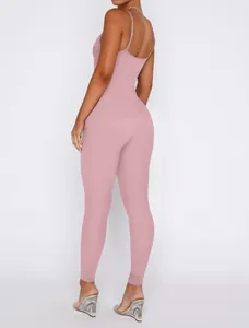 Back view of a pink ribbed backless jumpsuit showing form-fitting detail