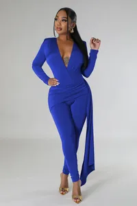Detail of royal blue long sleeve jumpsuit with sexy deep V-neck and draped side