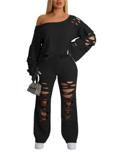 Two-piece black distressed lounge set with off-shoulder sweatshirt and ripped wide-leg pants