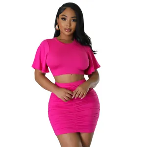 Sexy hot pink two-piece set featuring a flounced crop top and ruched mini skirt outfit