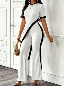 Elegant two-piece ribbed set featuring asymmetrical contrast crop top and wide-leg pants